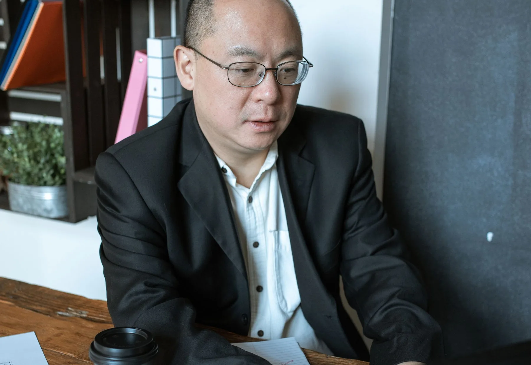 A client reviewing reporting at his desk